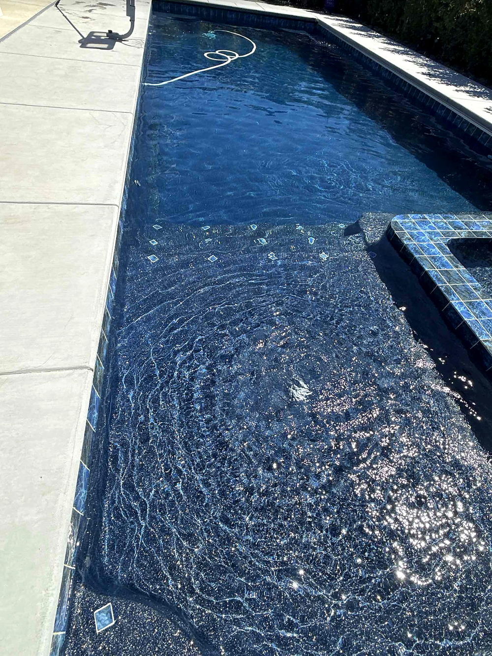 Sparkling gelcoat interior and glass waterline tile of a completed Latham Astoria 16