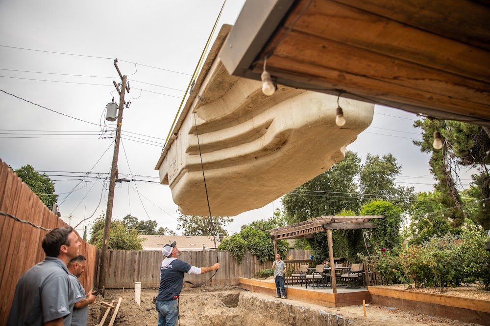 Latham Olympia 12 fiberglass shell set in place by the Neighborhood Pool Service crew